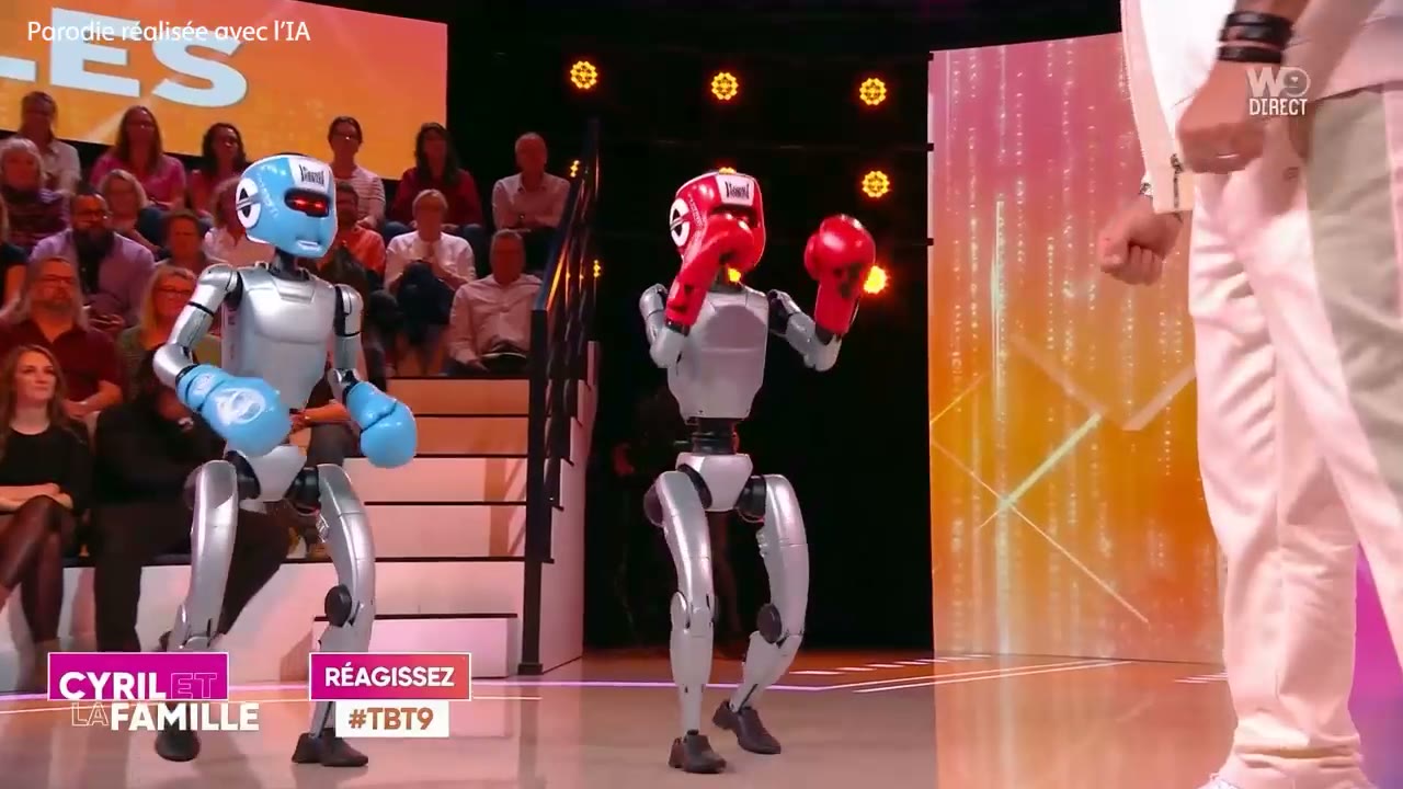 Les deux robots entrent sur le plateau, gants enfilés